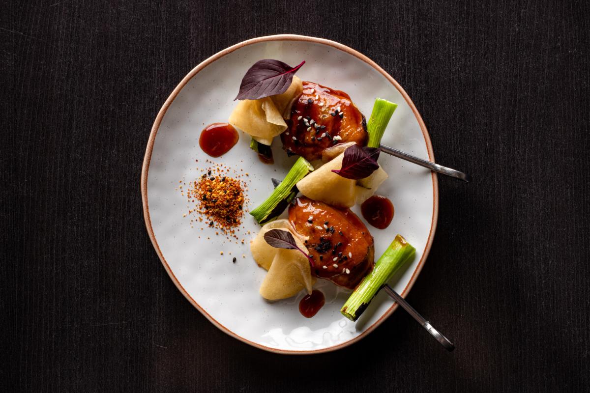 Grilled miso quail, preserved turnip, shichimichi and spring onion (image supplied)