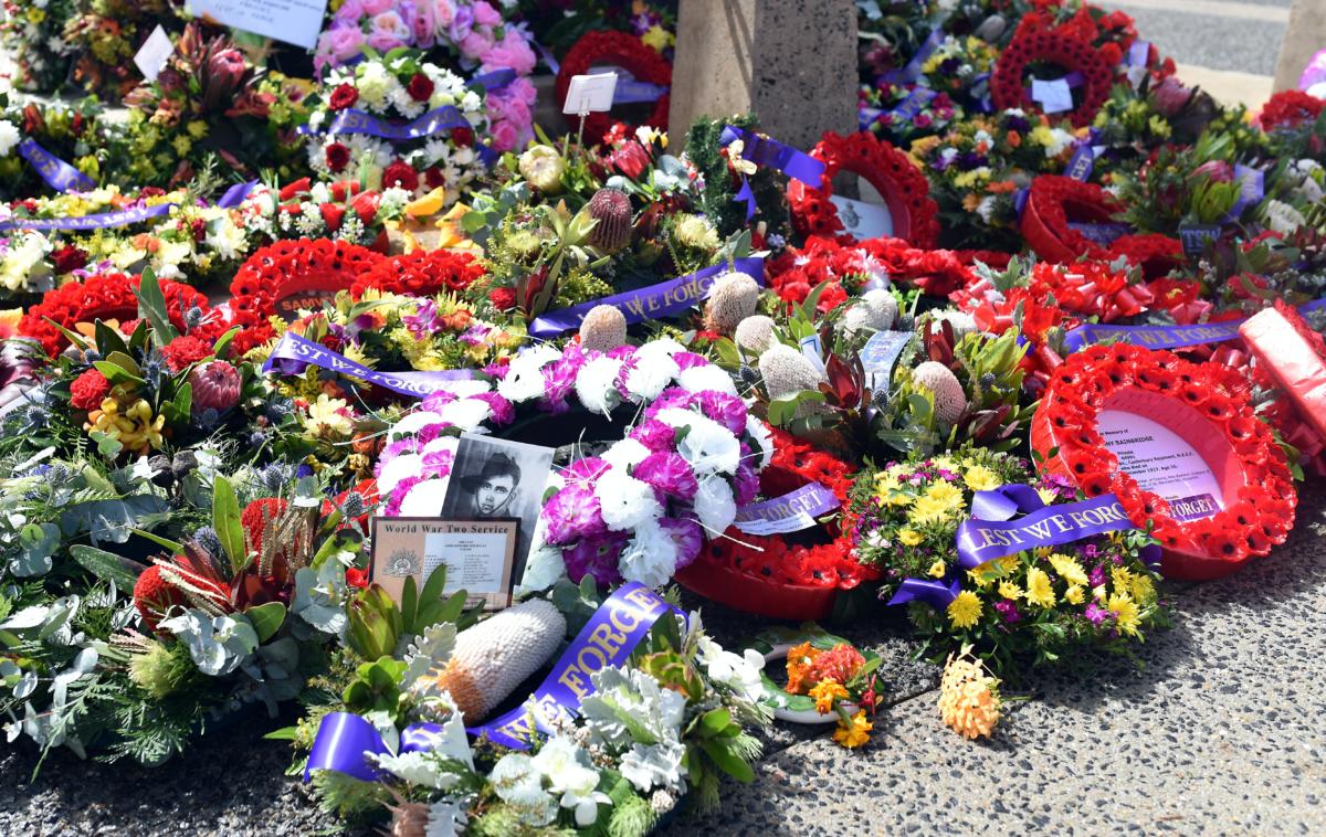 Flowers at the base of the ANZAC war memorial (image supplied)