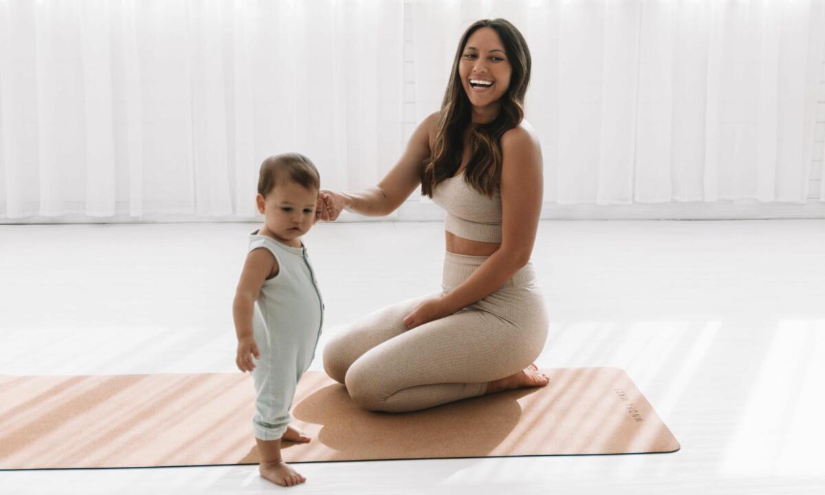 Emma Ceolin with her child, Yogaventures Yoga Studio (image supplied)