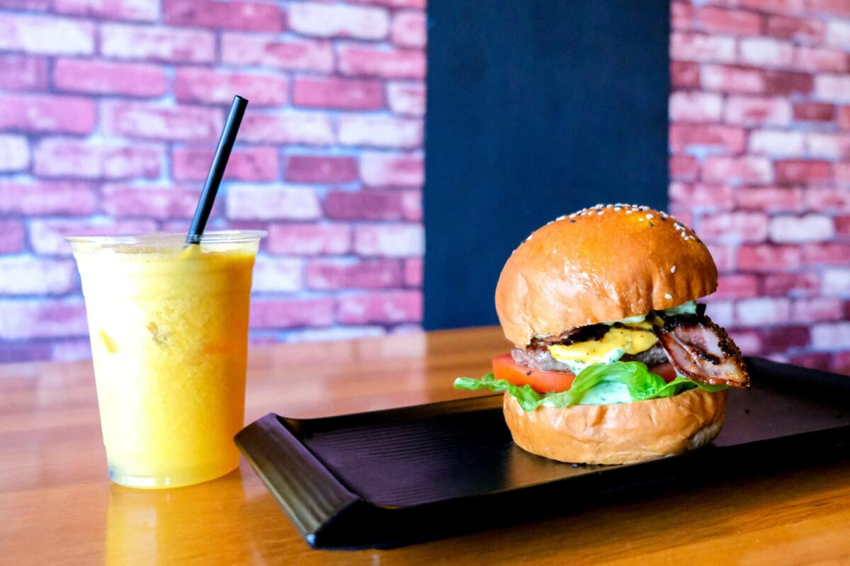 Fresh squeezed OJ and D’Pappy Burger, D'Alley Eatery (Image: © 2021 Inside Gold Coast)