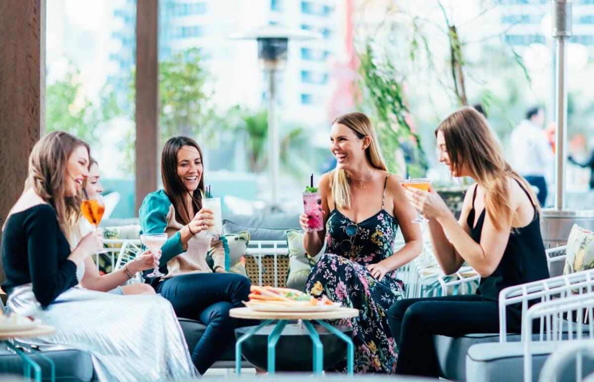 A group of women enjoying drinks at The Island Rooftop Bar (Image supplied by Destination Gold Coast)
