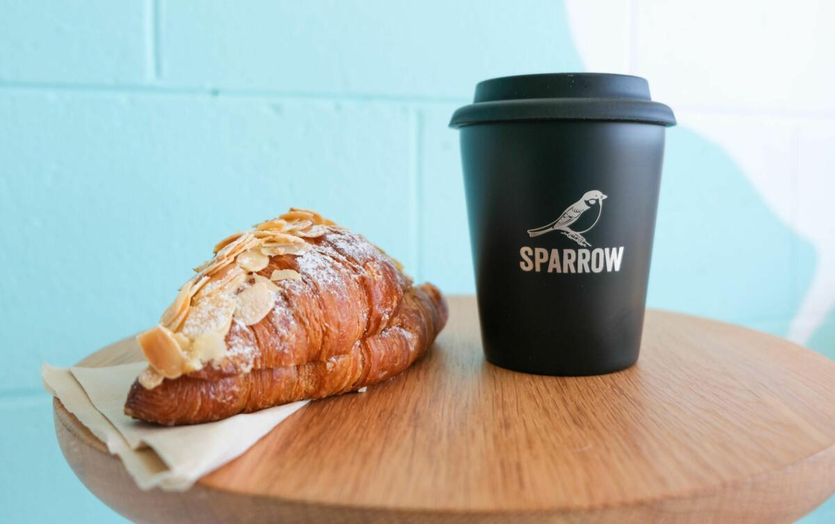 Almond Croissant & Reusable Cup from Sparrow Coffee Co. Nobby Beach (Image: © 2021 Inside Gold Coast)