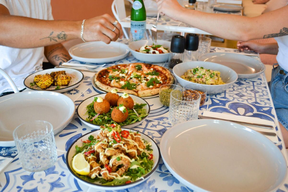 Clockwise: Grilled corn, Zucchini prawn pizza, Caprese salad, Fettuccine boscaiola, Calamari fritta & Arancini balls, Toro's Pizza (Image: © 2022 Inside Gold Coast)