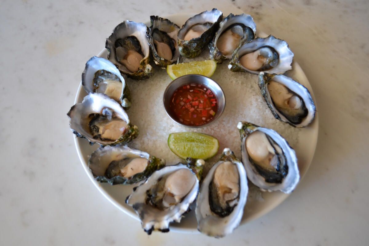 Freshly shucked oysters with seaweed mignonette and limes, Siblings Kirra (Image: © 2022 Inside Gold Coast)