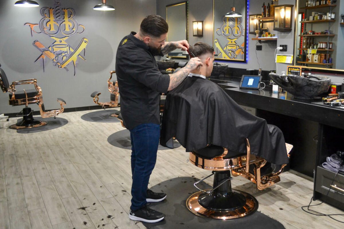 Chris Cutz with a client, The Barber Bar (Image: © 2022 Inside Gold Coast)