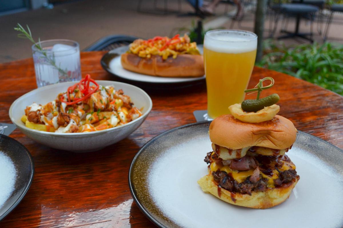 The Roadie Burger, Mac Miller Hot Dawg and Buffalo Loaded Fries at Burger Lane Co (Image: © 2022 Inside Gold Coast)