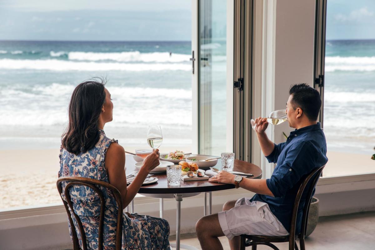 Couple enjoying a dining experience at Rick Shores, Burleigh Heads (image Destination Gold Coast)