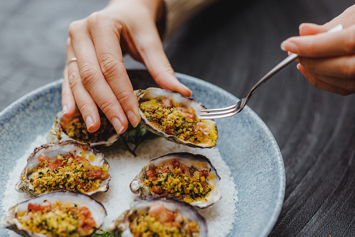Baked oysters with smoked CC whisky butter and bacon, Garden Kitchen & Bar (image supplied)