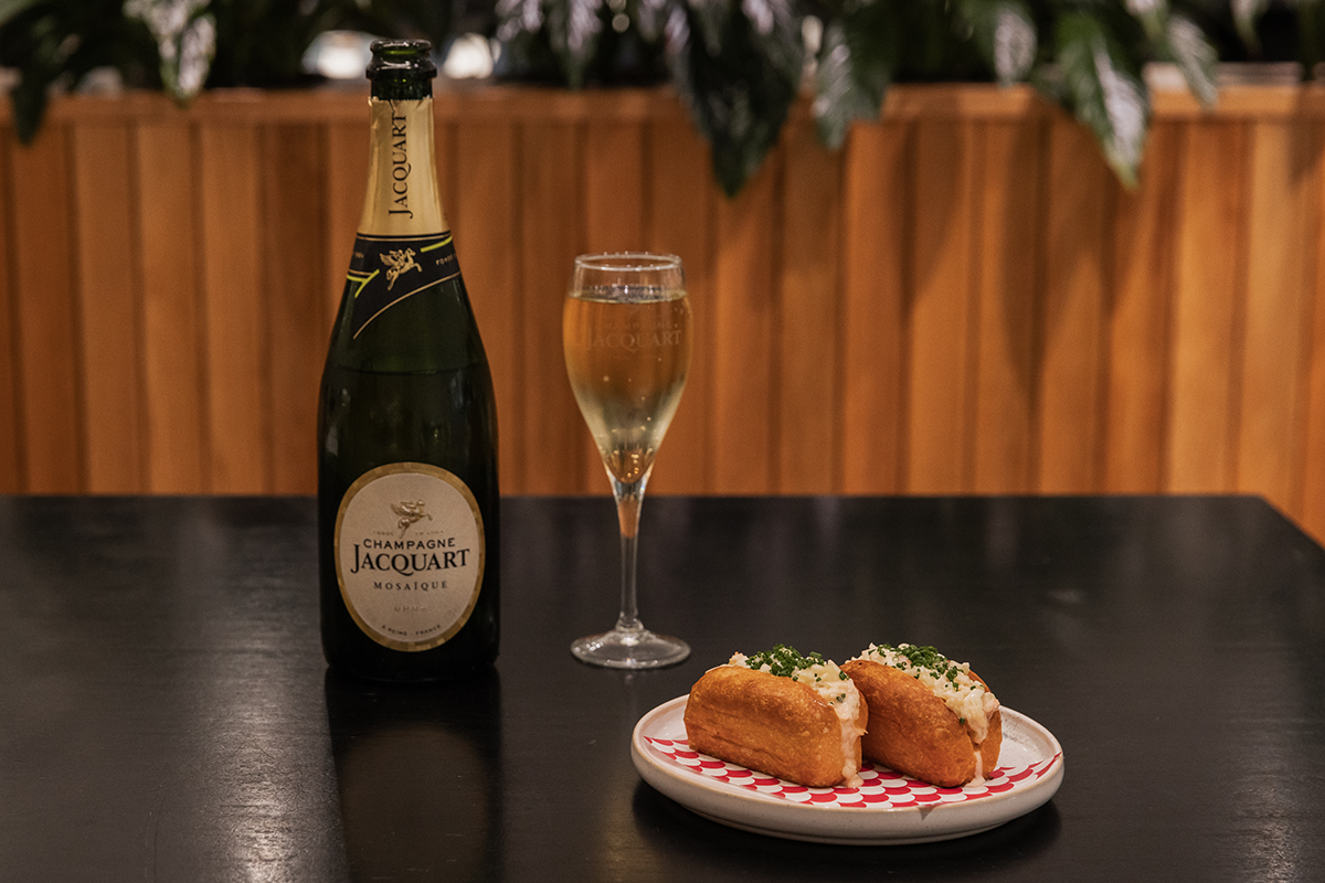 Champagne and lobster rolls at Squiseato, Pacific Fair, Broadbeach (Image: © 2023 Inside Gold Coast)