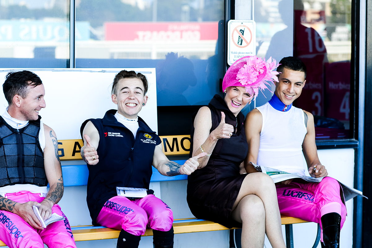 Robyn Cameron with Jockeys at Pink Ribbon Race Day (image supplied)