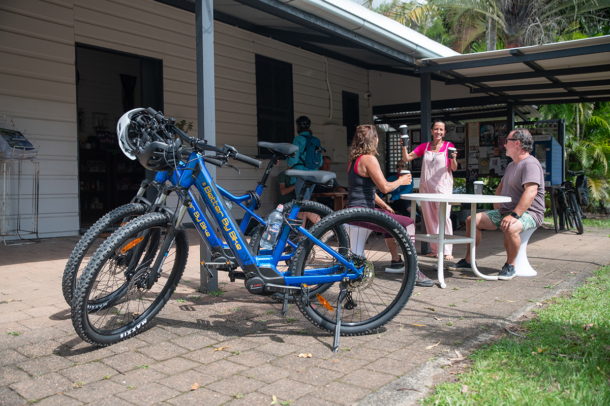 Grabbing a coffee at Stokers Siding Post Office Store Northern Rivers Rail Trail, Better By Bike (image supplied)