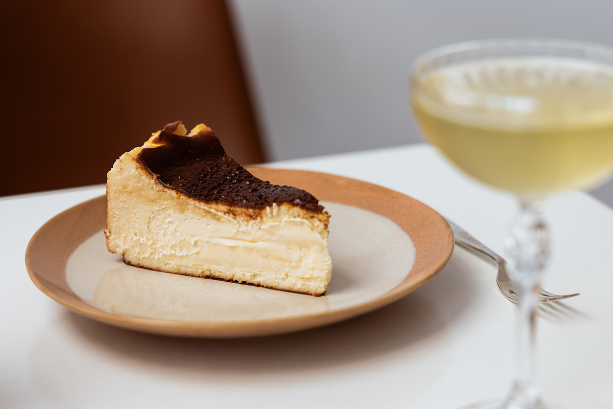 Cheesecake and champagne at Basque, Chirn Park (Image: © 2023 Inside Gold Coast)