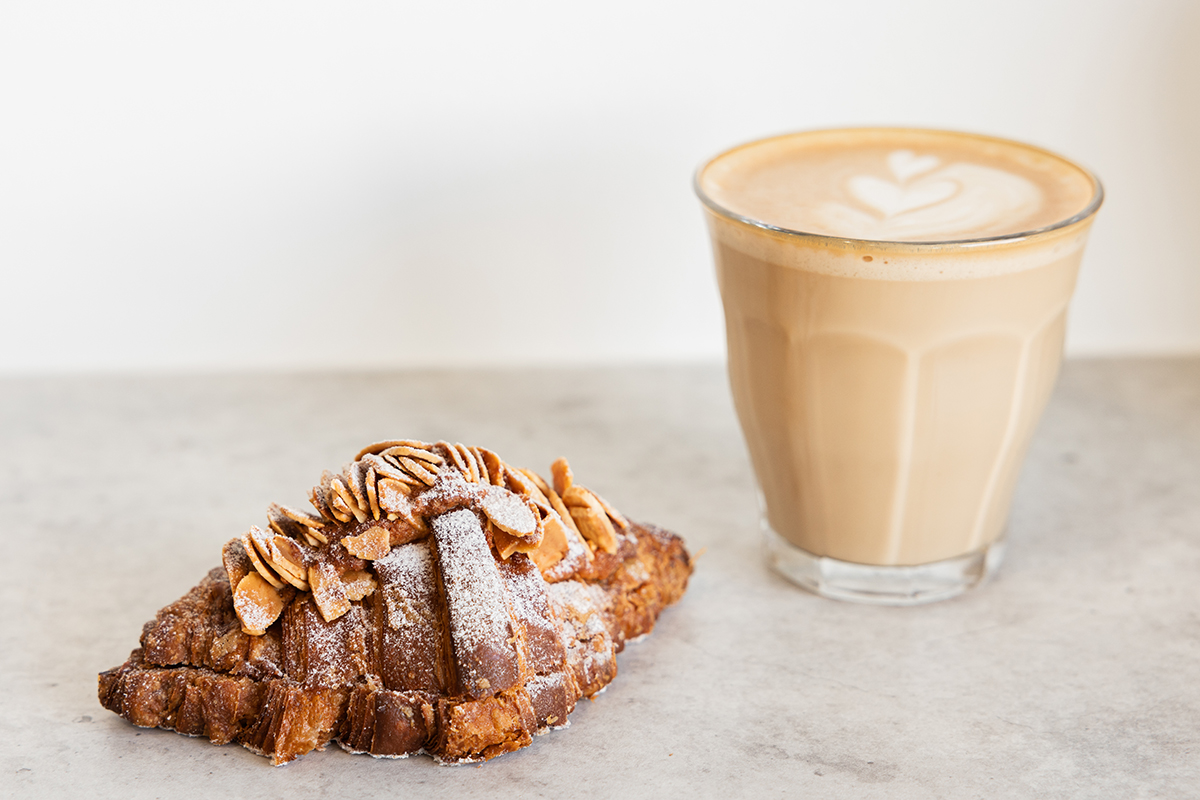 Almond Croissant and coffee at Dipcro Pastry, Chevron Island (Image: © 2023 Inside Gold Coast)