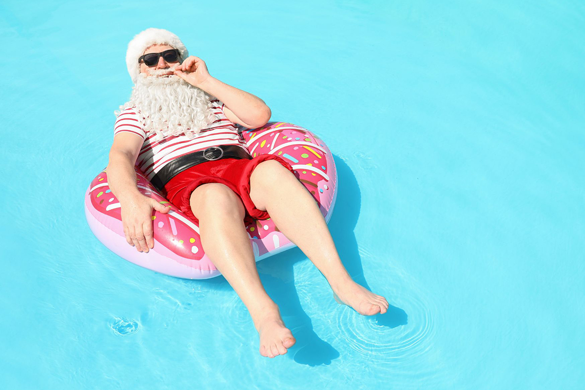 Santa floating in a pool (image supplied)