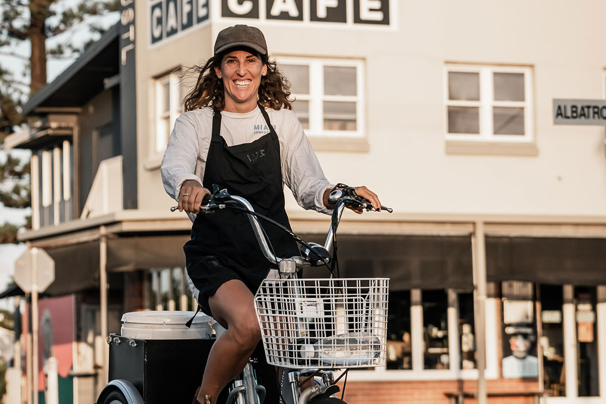 Jess, co-founder of Seed the Ground on her bike outside BSKT (image by supplied)